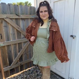 Women’s sleeveless ruffle apron front short dress